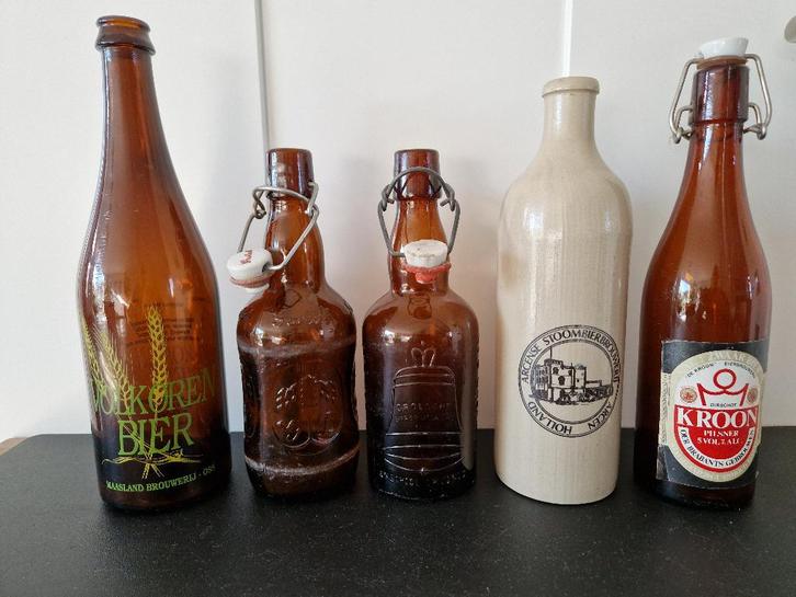 7 nederlandse bierflessen geverfd, geemailleerd en of relief, Verzamelen, Biermerken, Gebruikt, Flesje(s), Overige merken, Ophalen of Verzenden
