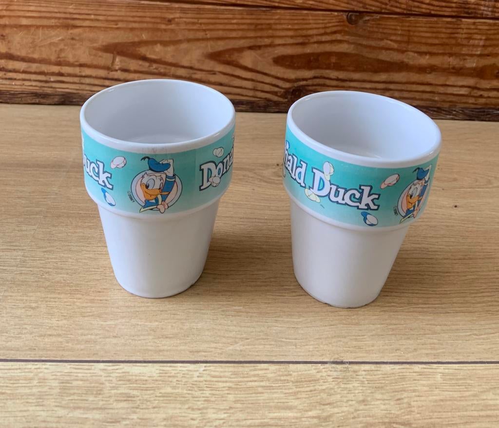 2 donald duck bekers, Huis en Inrichting, Ophalen of Verzenden, Zo goed als nieuw, Overige stijlen, Kop(pen) en/of Schotel(s)