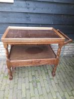 Oude theetafel met glazen plaat, Ophalen