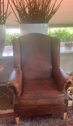 Rundlederen oorfauteuil, Ophalen