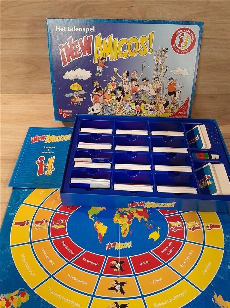 New Amigos - Het talenspel - Engels - Nederlands - s5863, Hobby en Vrije tijd, Gezelschapsspellen | Bordspellen, Verzenden, Zo goed als nieuw