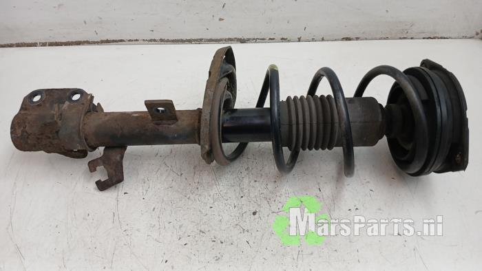 Schokdemperpoot links-voor van een Nissan Micra, Gebruikt, -, -, Ophalen of Verzenden