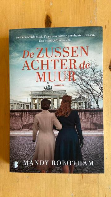 Mandy Robotham - De zussen achter de muur beschikbaar voor biedingen