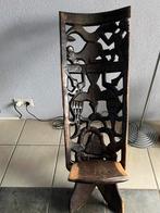 Afrikaans houtgesneden stoel, Ophalen