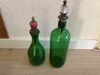 2 groene flessen met stop, Ophalen
