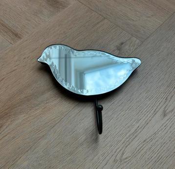 Spiegelhaakje in de vorm van een vogel beschikbaar voor biedingen