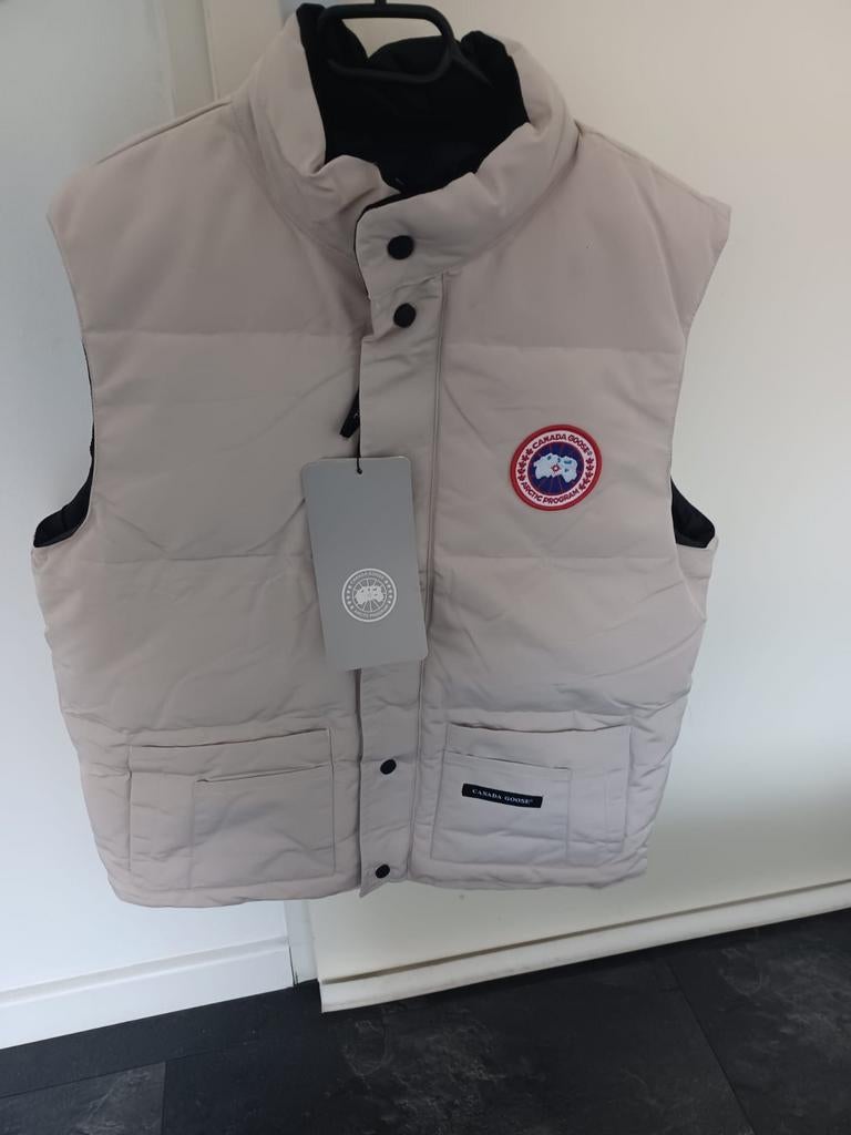 Bodywarmer Canada Goose (Nieuw) maat L, Kleding | Heren, Bodywarmers, Ophalen of Verzenden, Nieuw, Beige