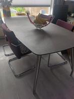 Mooie design eettafel, speciaal glas met RVS poten., Huis en Inrichting, Tafels | Eettafels, Ophalen, Modern., 100 tot 150 cm