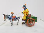 antiek blik speelgoed clown ,met ezel opwind baar, Ophalen of Verzenden