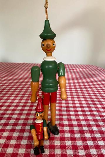 Vintage 2x houten Pinokkio met beweegbare armpjes/beentjes beschikbaar voor biedingen
