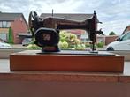 Antieke Singer naaimachine, Ophalen