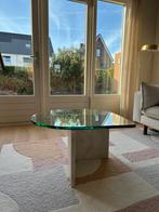 Glazen druppelvormige salontafel op travertin poot, Huis en Inrichting, Tafels | Salontafels, Ophalen, 50 tot 100 cm, 50 tot 100 cm