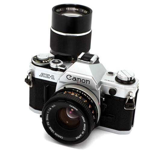 Canon AE-1 + FD 50mm f/1.8 S.C. + Panagor FD 135mm f/2.8, Audio, Tv en Foto, Fotocamera's Analoog, Zo goed als nieuw, Spiegelreflex