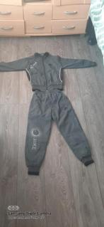 Grijze Nike trainingspak maat 128, Ophalen of Verzenden, Nieuw, Nike