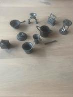 10 miniaturen tinnen beeldjes, Ophalen