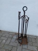 Gesmeed openhaard set, Ophalen