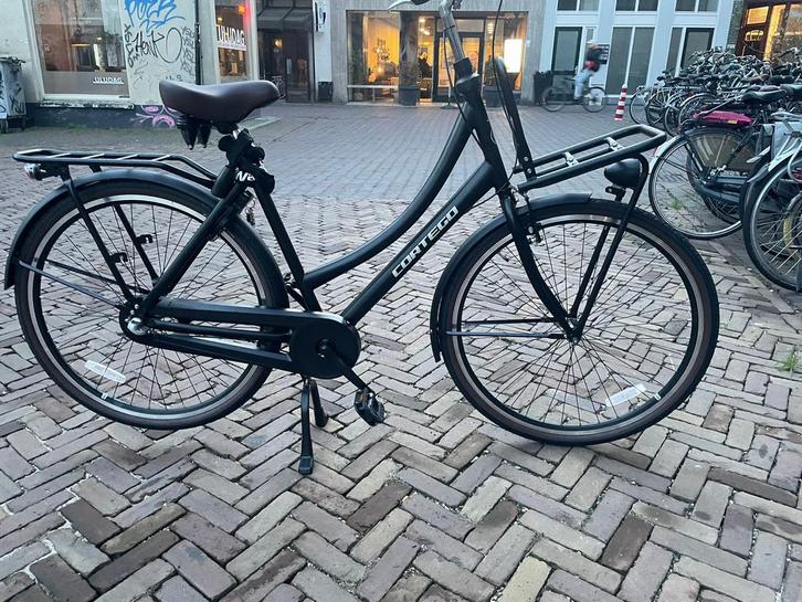 Nieuwe transportfiets, Cortego, 28inch, mat zwart, Fietsen en Brommers, Fietsen | Dames | Omafietsen, Zo goed als nieuw, Handrem