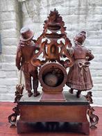 Koperen staande antieke klok, Ophalen