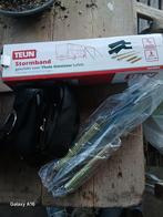 Stormband luifel, Ophalen