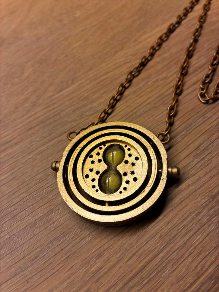 Harry Potter Tijdverdrijver Ketting, Sieraden, Tassen en Uiterlijk, Kettingen, Nieuw, Overige materialen, Goud, Met hanger, Ophalen of Verzenden