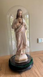 Heilig beeld in een stolp, Ophalen