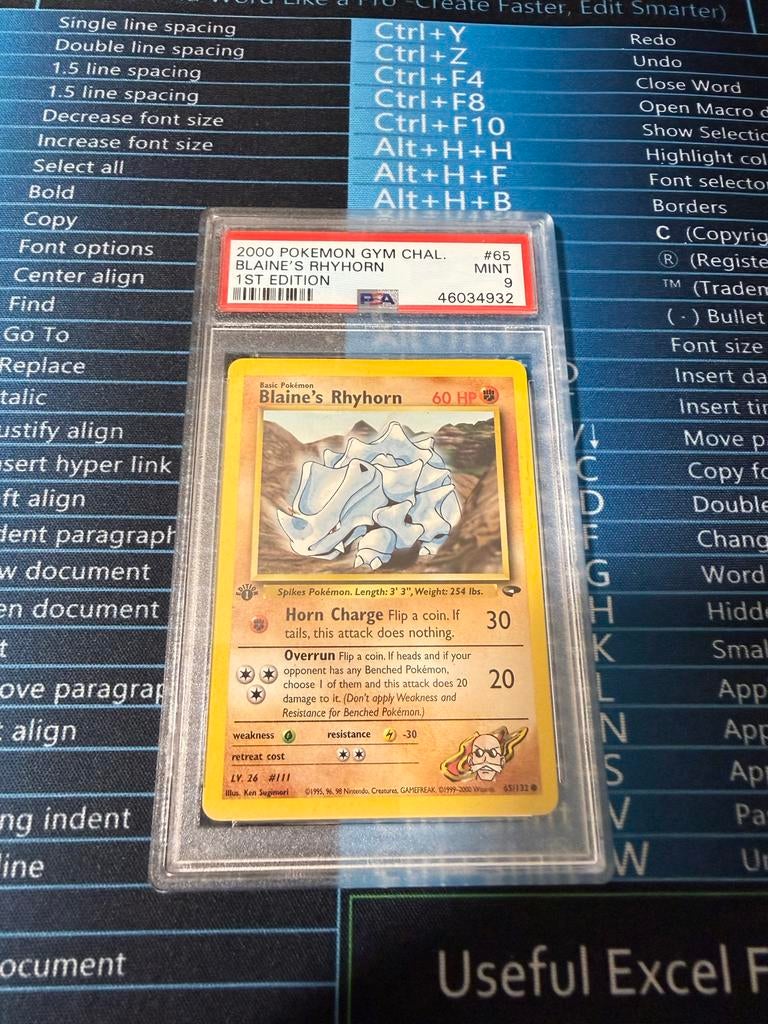 Pokémon Blaine's Rhyhorn 1st Edition PSA 9, Ophalen of Verzenden, Zo goed als nieuw, Losse kaart