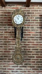 Antieke hangklok, Ophalen