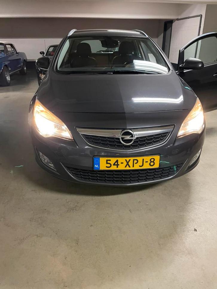 Opel Astra 1.3CDTI 70KW ST 2012 Grijs, Auto's, Opel, Bedrijf, Astra, Diesel, A, Stationwagon, Handgeschakeld, Origineel Nederlands