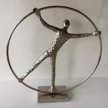 Beeld - Sportbeeld: Rhönrad Turnen - Man in hoepel beschikbaar voor biedingen