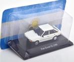 Jsn Atlas 1:43 Ford Escort GL 1988 wit in blisterverpakking, Hobby en Vrije tijd, Overige merken, Atlas / Altaya, -, Nieuw
