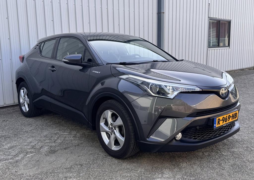 Toyota C-HR 1.8 Hybrid Active Clima / Cruise / Camera / 2019, Auto's, Toyota, Stof, 4 cilinders, 26 km/l, Hybride Elektrisch/Benzine