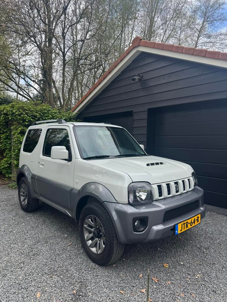 Suzuki Jimny 1.3 4WD 2017 Wit metallic 14.800 km 1e lak, Auto's, Zwart, 4 stoelen, Wit, Vierwielaandrijving