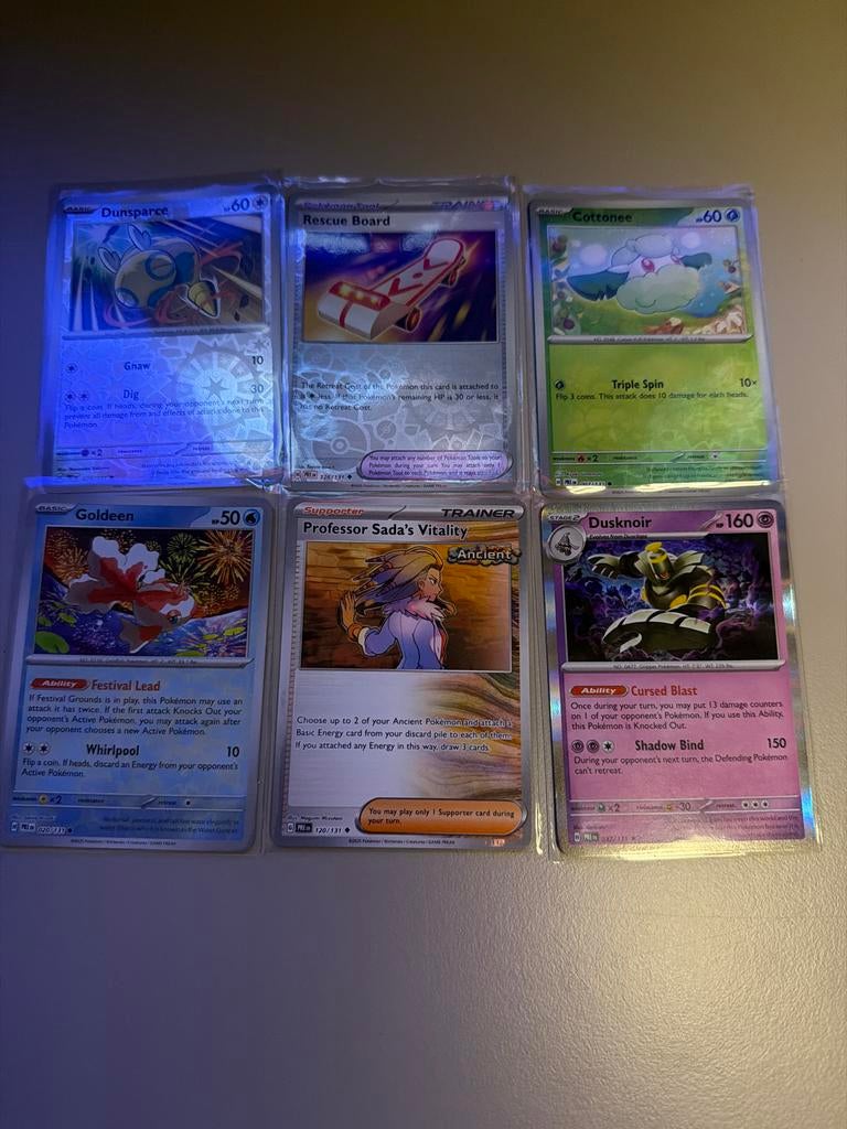 Prismatic Evolution - 6 Pokémon kaarten + soft sleeve, Ophalen of Verzenden, Zo goed als nieuw, Meerdere kaarten, Foil