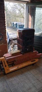 Steenkolen speksteen kachel, Ophalen