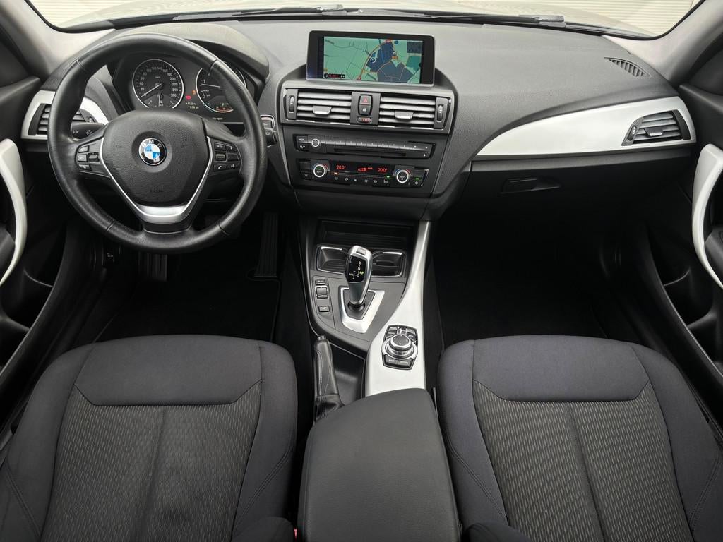 BMW 1-serie 118i Business 170PK|Sport|Cruise|Navi|Automaat, Auto's, Euro 5, Gebruikt, Zwart, 4 cilinders