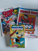 Donald Duck pocket en 2 strips., Ophalen of Verzenden, Zo goed als nieuw