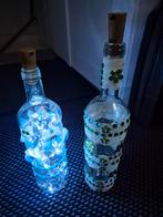 Flessen versierd met verlichting, Ophalen