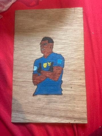 Houten schilderij van voetballer beschikbaar voor biedingen