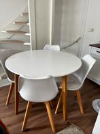Ronde eettafel met wit blad en houten poten, Huis en Inrichting, Tafels | Eettafels, Ophalen, Kunststof, Gebruikt, 100 tot 150 cm