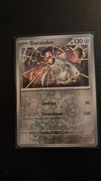 Duraludon reverse holo 129/191 Pokémon Surging Sparks, Hobby en Vrije tijd, Verzamelkaartspellen | Pokémon, Ophalen of Verzenden