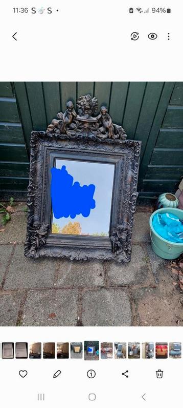Spiegel zwart met ornament.  beschikbaar voor biedingen