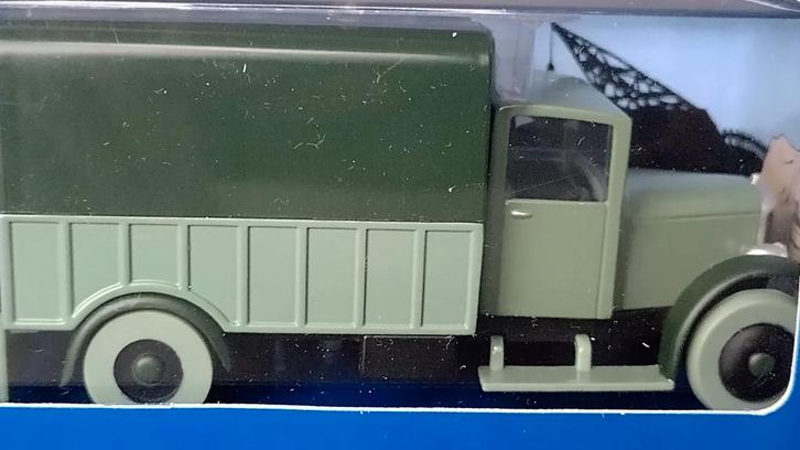 De vrachtwagen met Opium Ford A Kuifje blauwe lotus Pol, Hobby en Vrije tijd, Modelauto's | 1:43, Zo goed als nieuw, Auto, Overige merken