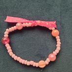 Roze kralen armband met strik, Kunststof of Plastic, Ophalen of Verzenden, Zo goed als nieuw, Roze