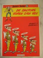 lucky luke --26--de daltons kopen zich vrij, Eén stripboek, Ophalen of Verzenden, Gelezen
