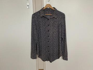Leuk, zwart witte blouse maat 40 beschikbaar voor biedingen