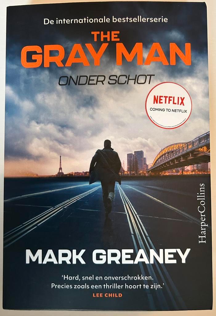 Boek - Mark Greaney - Onder schot - thriller, Boeken, Thrillers, Zo goed als nieuw, Ophalen of Verzenden