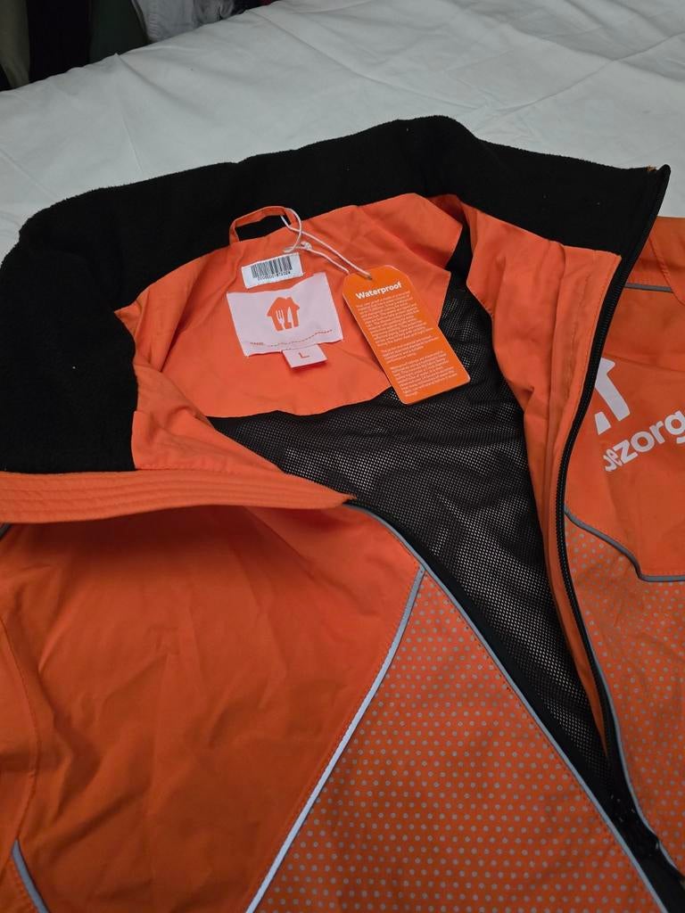 Nieuwe Thuisbezorgd Jas - Waterdicht & Winddicht, Maat 52/54 (L), Nieuw, Oranje, Ophalen of Verzenden