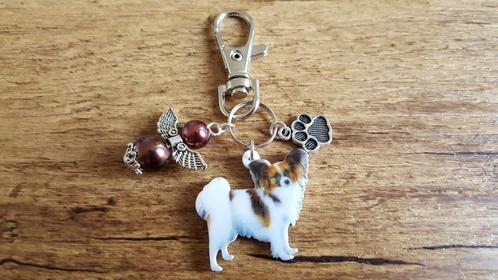 Sleutelhanger Papillon Vlinderhondje met beschermengeltje, Dieren en Toebehoren, Honden-accessoires, Nieuw, Verzenden