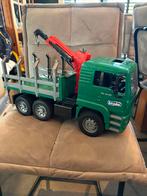 Bruder MAN TGA houttransportwagen met kraan.Schaal +/- 1:16., Ophalen of Verzenden, Zo goed als nieuw