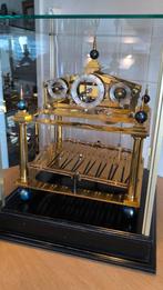 Rolling ball clock., Ophalen